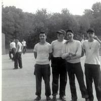 Four juniors standing in the handball court space across he river road from the main ball fields. Tully, McCormick, Keough and O'Shea. 